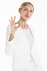 Businesswoman showing okay hand sign