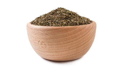 mint leaves in wooden bowl isolated on white background. Spices and food ingredients.