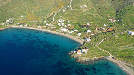 Aerial drone photo of famous and picturesque turquoise double beach of Flabouria with small beautiful orthodox church of Panagia Flabouriani in island of Kythnos at spring, Cyclades, Greece
