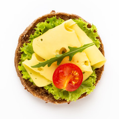 Sandwich with lettuce, cheese on white background.