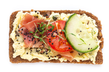 Sandwiches with cream cheese, vegetables and salami.