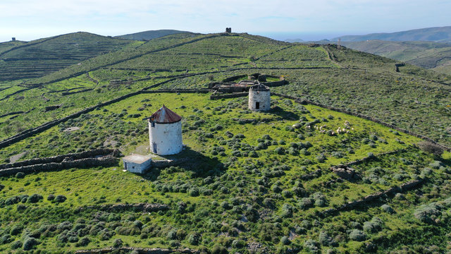 Aerial drone spring photo of picturesque windmill in island of Kythnos overlooking the Aegean sea, Cyclades, Greece