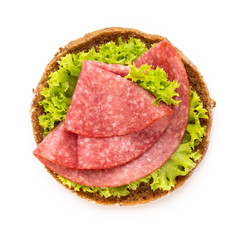 Sandwich with salami sausage on white background.