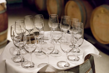 Empty wine glasses on a tray in the wine cellar