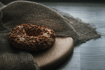 Whole grain cereal shortbread biscuits cookies stacked with nuts. Wooden background