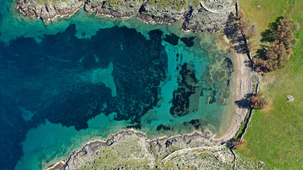 Aerial drone photo of tropical caribbean bay with white sand beach and beautiful turquoise and sapphire clear sea