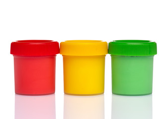Colorful Gouache jars isolated on white background with copy space. Cans of different colors gouache paints.