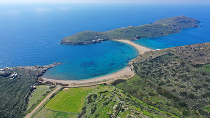 Obraz premium Aerial drone panoramic photo of iconic two sided sandy tropical turquoise sea paradise beach of Kolones near Fykiada in island of Kythnos at spring, Cyclades, Greece