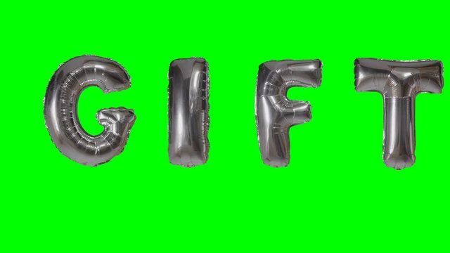 Word gift from helium silver balloon letters floating on green screen