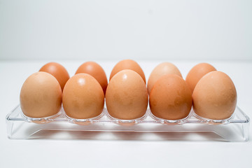 Close up of chicken eggs over white background