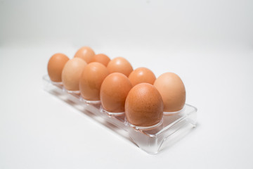 Close up of chicken eggs over white background