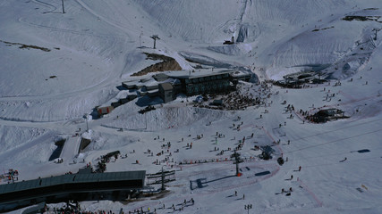 Aerial drone photo of popular winter ski destination in Swiss mountain covered up with snow
