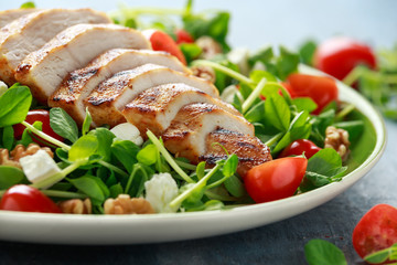 Fresh Grilled Chicken salad with tomatoes, feta cheese and vegetables