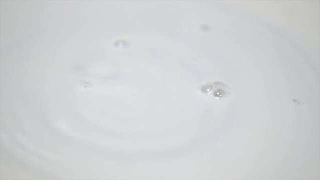 Slowmo Milk Close Up in Pan