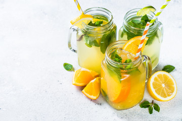 Lemonade, mojito and orange lemonade on white.