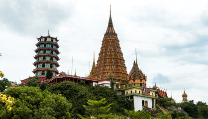 Fototapeta na wymiar Wat Tham Suea with clouds in the background