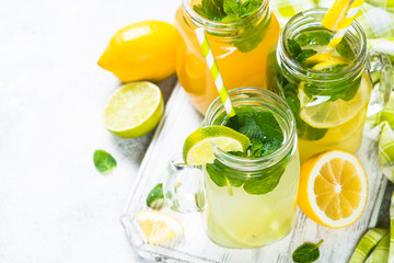 Lemonade, mojito and orange lemonade on white.