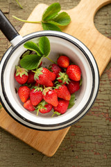 Harvest of organic strawberries, food above