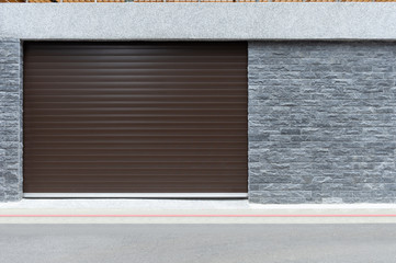 A closeup shot of automatic metal roller door used in factory, storage, garage, and industrial...