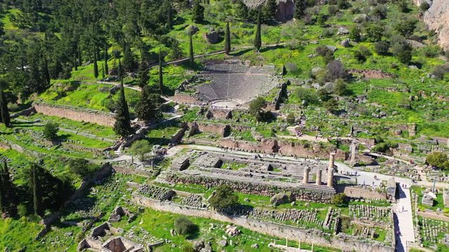Aerial drone video of iconic Temple of Apollo in archaeological site of Delphi one of the most important of Ancient times, Voiotia, Greece