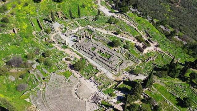Aerial drone video of iconic Temple of Apollo in archaeological site of Delphi one of the most important of Ancient times, Voiotia, Greece