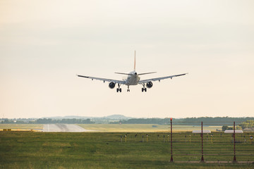 Fototapeta na wymiar big Airpalne landing un a runway at the prague airport 