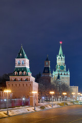 Fototapeta na wymiar Night or evening view on the illuminated towers of Moscow Kremlin on the Red square in Russian capital with the lanterns in the winter or in the spring 