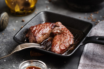 Grilled meat Steak Machete with salt and pepper on slate board black background