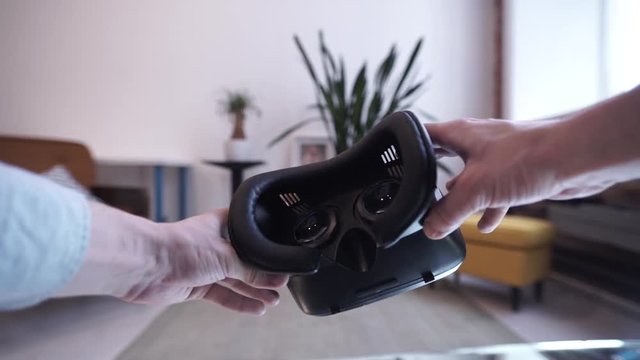 Putting on VR glasses Virtual Reality point of view taking of VR glasses