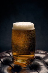glass of beer on wooden background