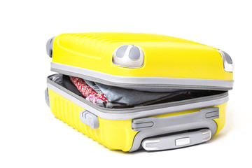 Isolated open suitcase with lots of clothes inside