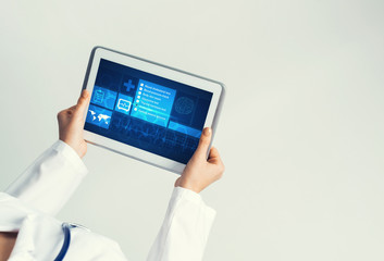 Close of female doctor hands working with tablet pc computer