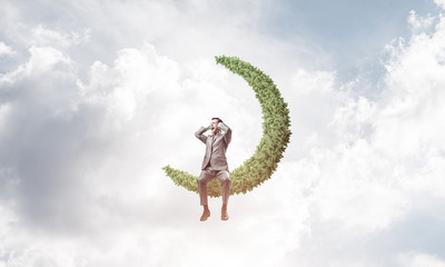 Young man in sky on moon do not want to hear anything