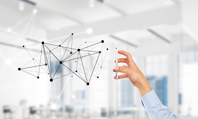 Business and technology concept with networking grid and man using device