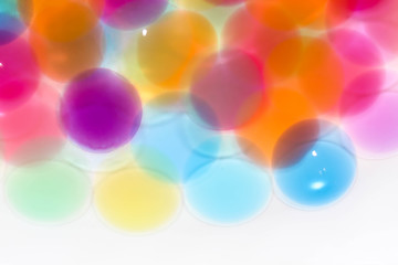 Water coloured gel balls. Polymer gel. Silica gel. Balls of blue hydrogel. Crystal liquid ball with reflection. Texture background. Close up macro