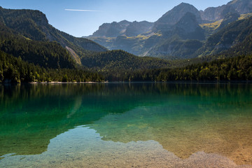 Fototapeta na wymiar Beautiful view of Lake Tovel, the largest of all natural lakes in Trentino in the Adamello Brenta Park.