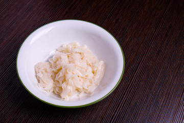 Kuey teow in a white bowl on the table