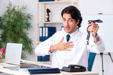 Young doctor cardiologist working in the clinic 