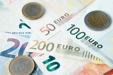 Euro banknotes and coins background . Money and finances concept.