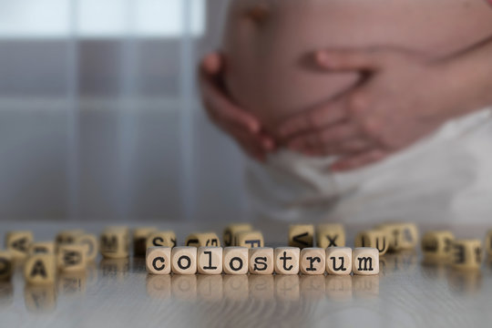 Word COLOSTRUM composed of wooden letters.