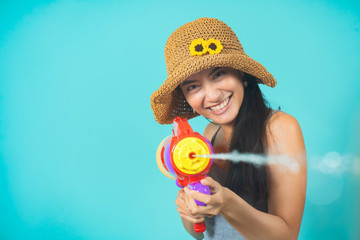 Asian people are using water guns Play in Songkran Festival She applied the powder on the face. The studio concept