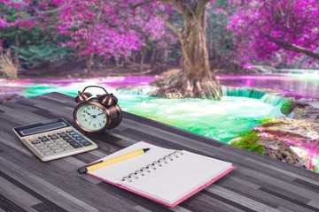 book note ,smart phone on office table with nature view.