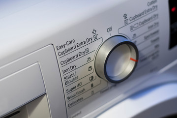 Rotary knob and labels from laundry dryer.