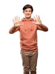 Teenager man with sweatshirt counting nine with fingers over isolated white background