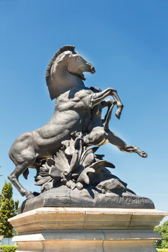 Sculpture of famous French nineteenth sculptor  Emmanuel Fremiet. Lioness attacking a horse in Polish park Swierklaniec.