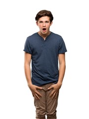 Fototapeta premium Teenager man with surprise facial expression over isolated white background