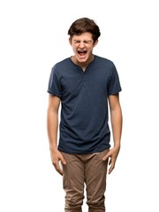 Fototapeta premium Teenager man shouting to the front with mouth wide open over isolated white background