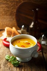 Homemade pumpkin soup with chili pepper