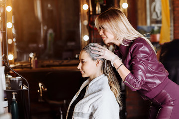 Beautiful woman in hair salon