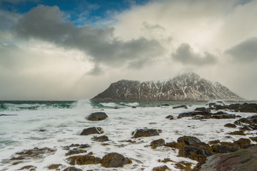 Rocks falling into the sea near Skagsanden beach. Lofoten islands, Norway